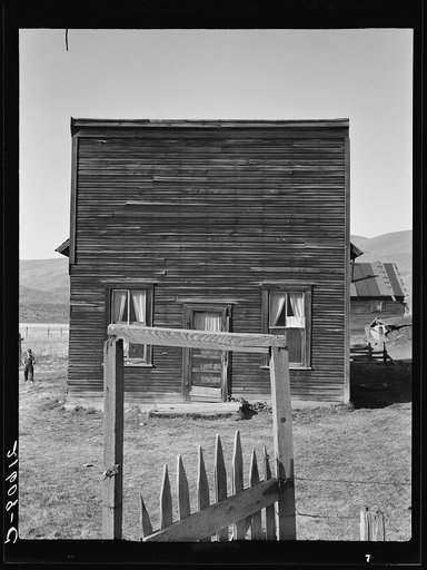 Member of the Ola self-help sawmill co-op lives in this former saloon and stagecoach tavern. Gem County, Idaho. General caption 48