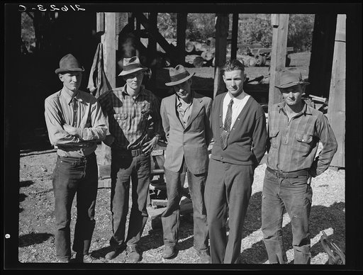 Untitled photo, possibly related to: Men working in mill. Ola self-help sawmill co-op. Gem County, Idaho. Man in rear center in black hat is FSA (Farm Security Administration) county supervisor. General caption 48
