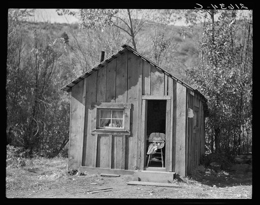Home of one member of Ola self-help sawmill co-op, Gem County, Idaho. "She likes to sit in the door and watch the geese." General caption 48