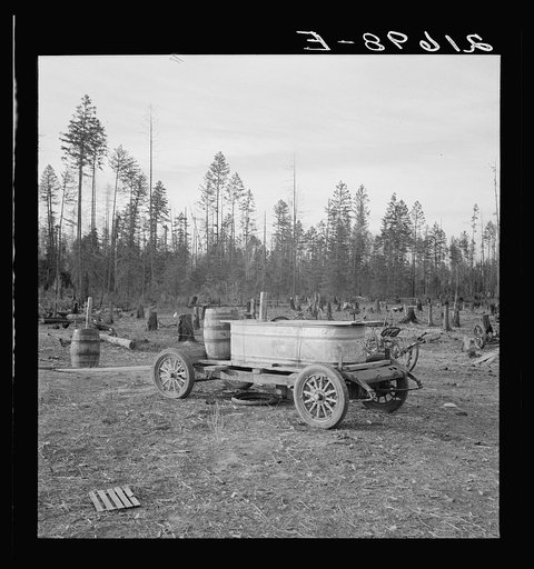 Untitled photo, possibly related to: Improved water tank on stump ranch. Boundary County, Idaho. See general caption 53