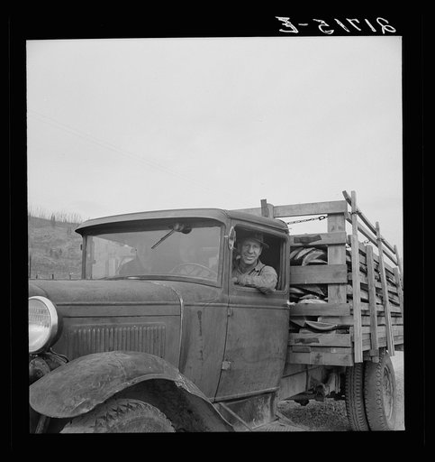 Stump farmer bringing load of slab wood to sell in town. Bonner County, Idaho. See general caption 49
