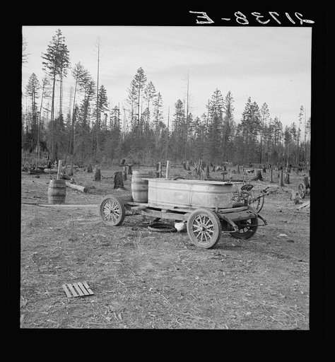 Untitled photo, possibly related to: Improved water tank on stump ranch. Boundary County, Idaho. See general caption 53