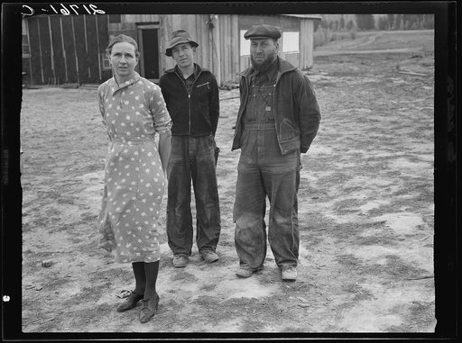 The mother, father, and hardworking fifteen-year-old son in yard before the barn. Boundary County, Idaho. See general caption 52