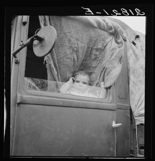 Untitled photo, possibly related to: Baby from Mississippi parked in truck at FSA (Farm Security Administration) camp, Merrill, Oregon. See general caption 62