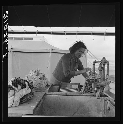 Young migrant girl makes use of facilities provided for cleanliness. Merrill FSA (Farm Security Administration) camp, Klamath County, Oregon. See general caption 62