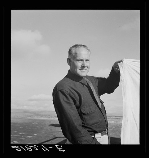 Untitled photo, possibly related to: Camp manager talking to another man. FSA (Farm Security Administration) mobile camp. Merrill, Klamath County, Oregon
