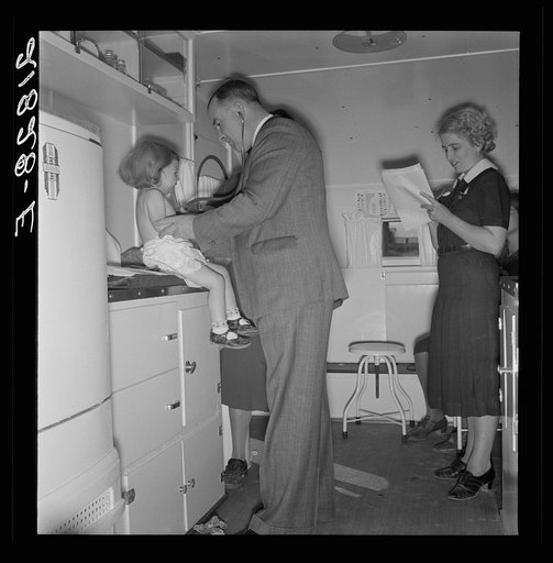 Untitled photo, possibly related to: Doctor examining children in trailer clinic. FSA (Farm Security Administration) mobile camp, Klamath County, Oregon. See general caption 62