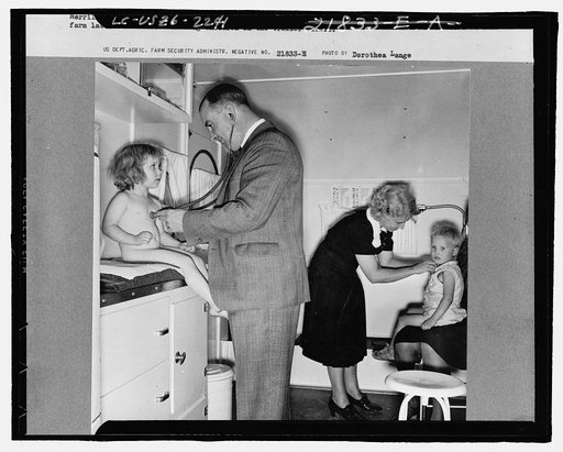Doctor examining children in trailer clinic. FSA (Farm Security Administration) mobile camp, Klamath County, Oregon. See general caption 62