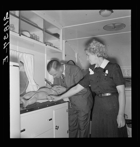 Doctor, nurse assisting, examines migrant child in trailer clinic. Merrill FSA (Farm Security Administration) camp, Klamath County, Oregon. See general caption 62
