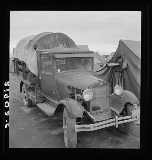 Truck, baby parked on front seat. Merrill, Klamath County, Oregon, in FSA (Farm Security Administration) camp