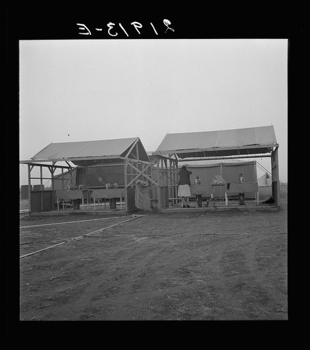 Untitled photo, possibly related to: Portable laundry unit, shower unit beyond. FSA (Farm Security Administration) camp, Merrill, Oregon. See general caption 62