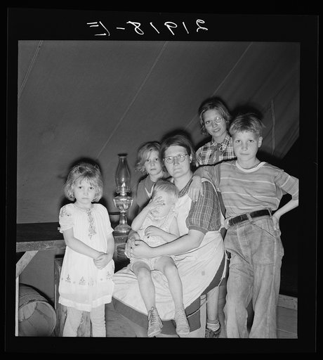 Untitled photo, possibly related to: Family of six in tent after supper. Came to potato harvest after father was laid off of WPA (Work Projects Administration) in Boise, Idaho. Oldest child is twelve. Little boy has dysentery. Merrill, Klamath County, Oregon. In FSA (Farm Security Administration) mo