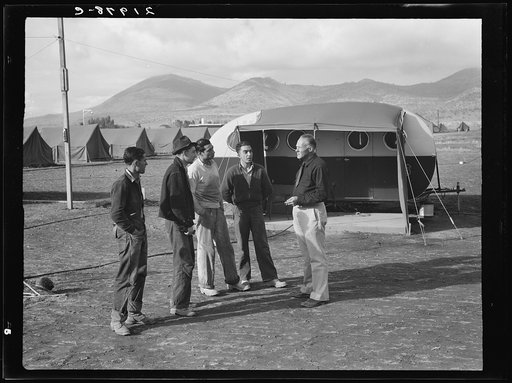 Untitled photo, possibly related to: Four young migratory potato pickers, travelling together, come into camp to ask manager whether they would be eligible for a hot bath. "Sure, boys, but clean up afterwards." Merrill, Klamath County, Oregon. FSA (Farm Security Administration) camp