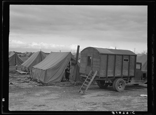 In mobile camp at end of season, cold day. Merrill, Klamath County, Oregon, FSA (Farm Security Administration) camp