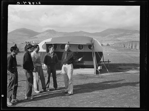 Four young migratory potato pickers, travelling together, come into camp to ask manager whether they would be eligible for a hot bath. "Sure, boys, but clean up afterwards." Merrill, Klamath County, Oregon. FSA (Farm Security Administration) camp