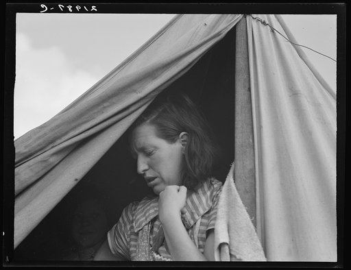 "We made good money in the cherries this year. From then on we made just beans." Merrill, Klamath County, Oregon. Woman in mobile unit of FSA (Farm Security Administration) camp