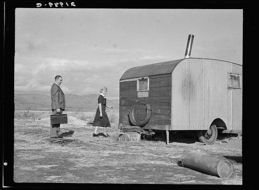 Nurse in FSA (Farm Security Administration) mobile camp unit conducts doctor to house trailer where there is a sick child. Merrill, Klamath County, Oregon
