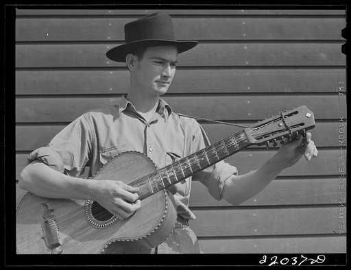 Weslaco, Texas. FSA (Farm Security Administration) camp. Boy musician
