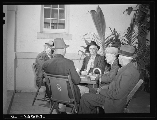 Brownsville, Texas. Winter tourists playing cards at the Chamber of Commerce building