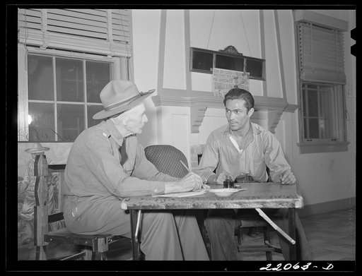 Brownsville, Texas. Retired army officer registering men for Selective Service at the Chamber of Commerce