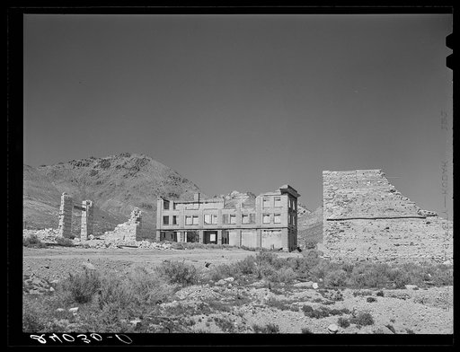 Untitled photo, possibly related to: Ruins of buildings in ghost mining town. Rhyolite, Nevada