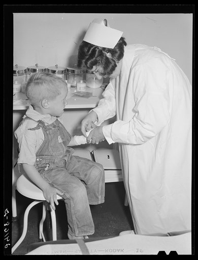 Untitled photo, possibly related to: Child being treated in health clinic. Tulare migrant camp. Visalia, California