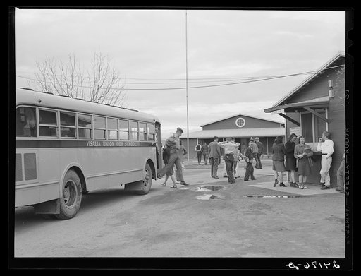 Untitled photo, possibly related to: Migrant high school students arriving home from school. Tulare migrant camp. Visalia, California