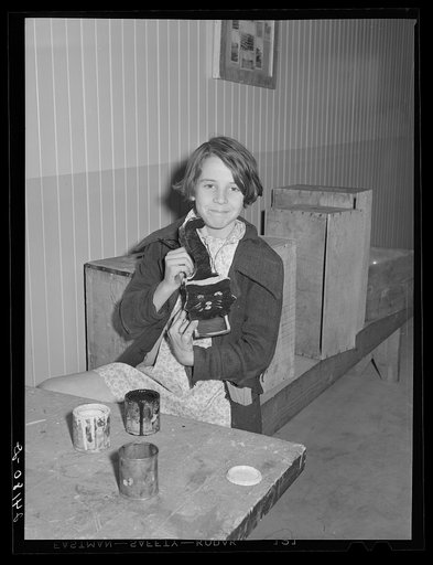 Girl working in woodshop. Tulare migrant camp. Visalia, California