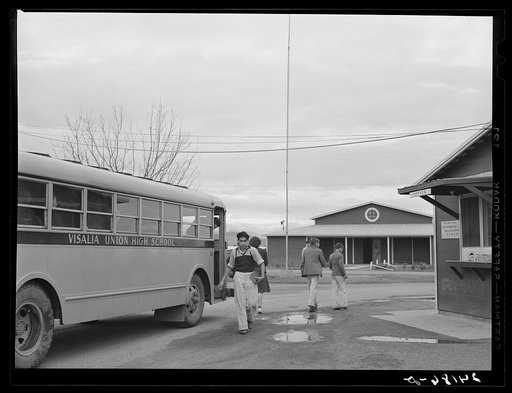 Untitled photo, possibly related to: Migrant high school students arriving home from school. Tulare migrant camp. Visalia, California