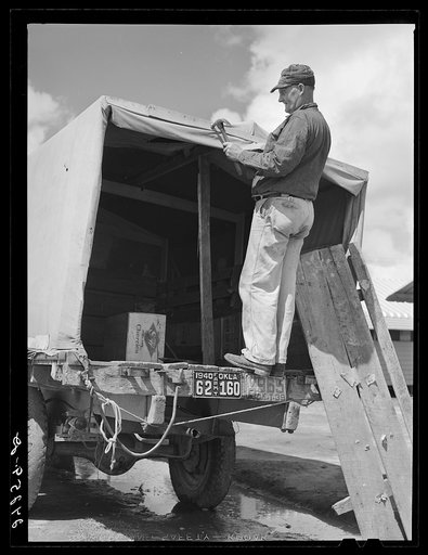Man repairing truck. Returning to Oklahoma. Tulare migrant camp. Visalia, California