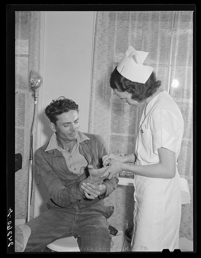 Patient receiving medical aid in health clinic. Shafter migrant camp. Shafter, California