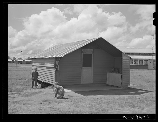 Children playing in front of house. Tulare migrant camp. Visalia, California