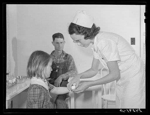 Nurse treating child in health clinic. Shafter migrant camp. Shafter, California