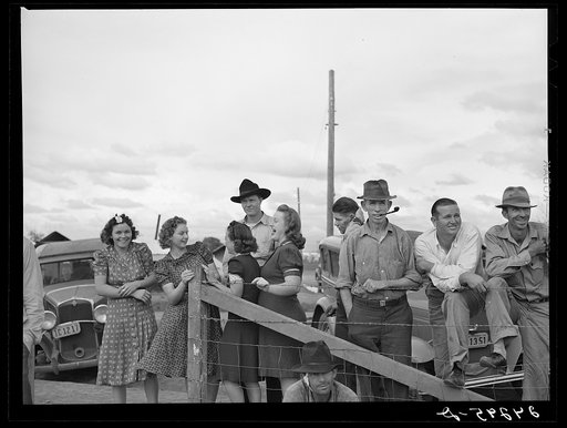 Untitled photo, possibly related to: Watching a Sunday afternoon baseball game. Tulare migrant camp. Visalia, California