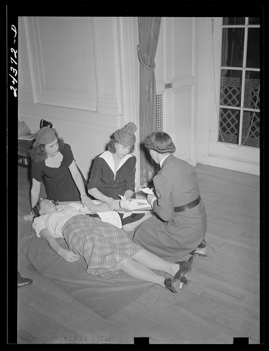 Untitled photo, possibly related to: Practicing placing a splint on the arm. At the American Red Cross, New York City