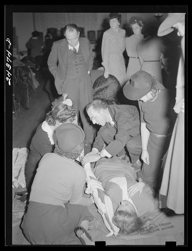 Untitled photo, possibly related to: First aid class, American Red Cross, New York City. Demonstrating splint on fractured arm