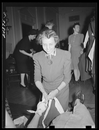 Untitled photo, possibly related to: First aid class, American Red Cross, New York City. Demonstrating splint on fractured arm
