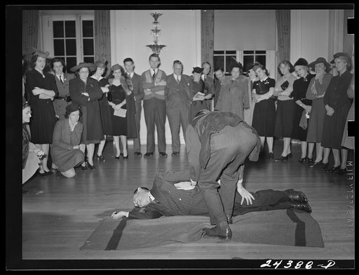 Untitled photo, possibly related to: Civilian Defense volunteers receiving instruction in treatment of fractured arm. First aid class. American Red Cross, New York City
