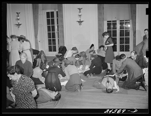 Untitled photo, possibly related to: Civilian Defense volunteers receiving instruction in treatment of fractured arm. First aid class. American Red Cross, New York City
