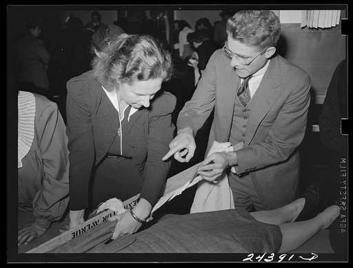 Untitled photo, possibly related to: Civilian Defense volunteers receiving instruction in treatment of fractured arm. First aid class. American Red Cross, New York City