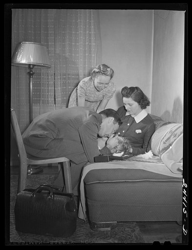 Dr. Jack Tabor, the project doctor, examining Roscoe Loudin, son of one of the homesteaders. Dr. Tabor is in charge of the health program, which emphasizes preventive aspects of medicine. There is a group health plan in which 160 of the 180 project families participate. Dailey, West Virginia