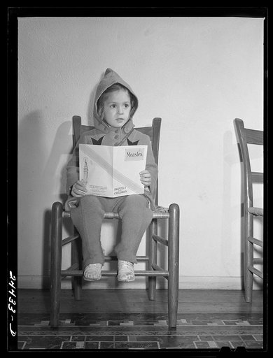 Elizabeth Darkey, daughter of one of the project families, waiting in the health center to be inoculated against measles. Dailey, West Virginia
