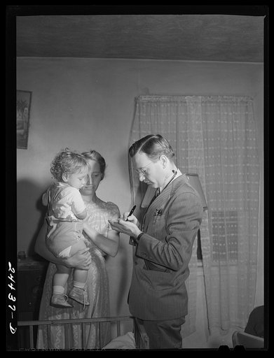 Dr. Tabor writing instructions for medicine for Roscoe Loupin. Dailey, West Virginia