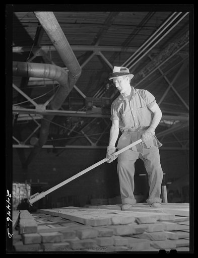 Worker on lumber stacks. Dimension lumber plant. Dailey, West Virginia