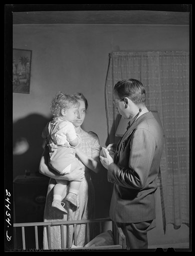 Untitled photo, possibly related to: Dr. Tabor writing instructions for medicine for Roscoe Loupin. Dailey, West Virginia