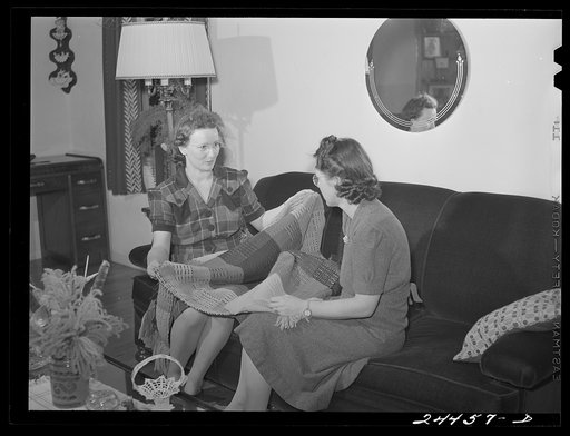 Mrs. Hardeman showing hand-woven curtains to Mrs. Golden, who also works at weaving shop. Dailey, West Virginia