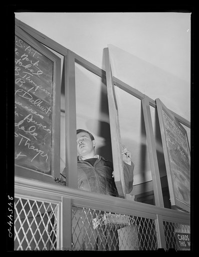 New York, New York. Listing ships in need of sailors at the Hiring Hall of the National Maritime Union