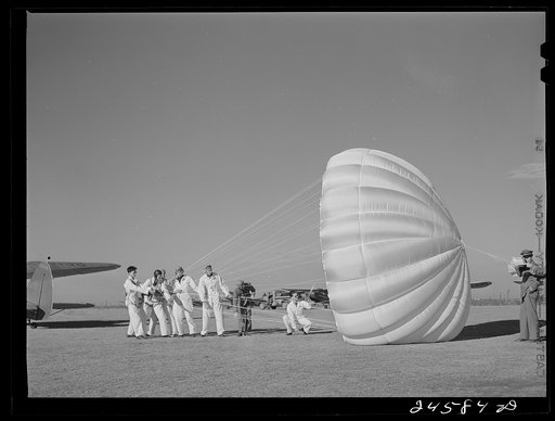 Instructor explaining operation of parachute to students. Meacham Field, Fort Worth, Texas