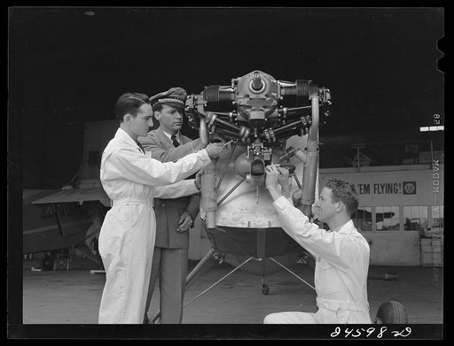 Students working on airplane motor at civilian pilot training school. Meacham Field, Fort Worth, Texas