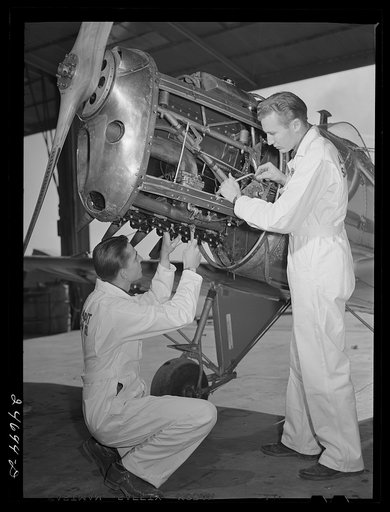 Fort Worth, Texas. Meacham Field. Students repairing plane motor
